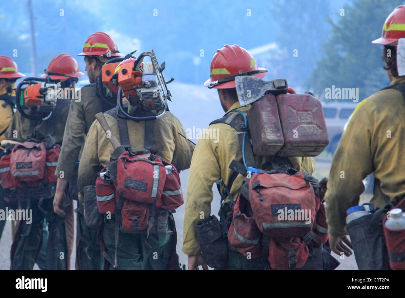 U.S. Forest Service fire crew members prepare to fight a forest fire near Bonner, Montana, USA. Stock Photo