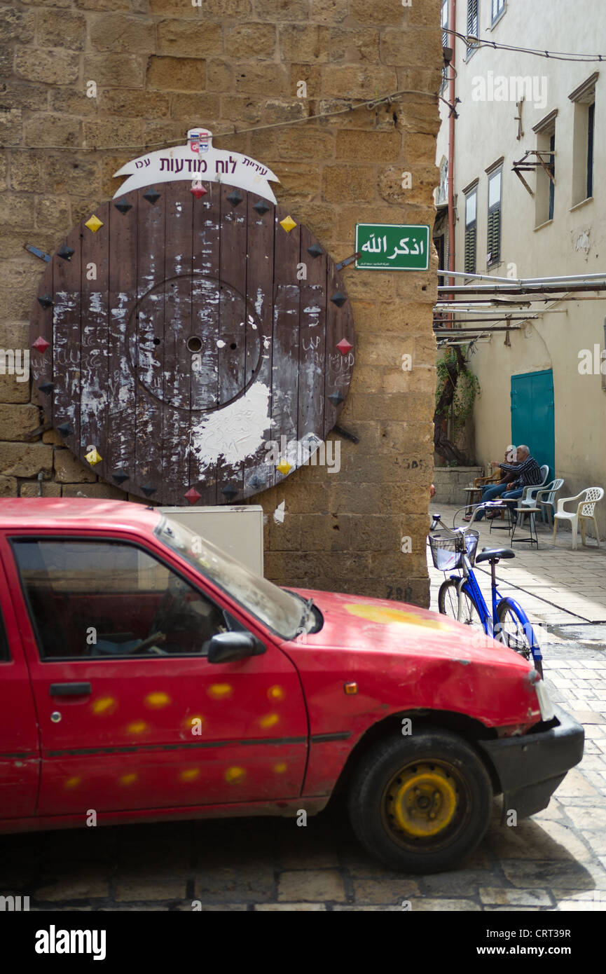 Empty round bulletin board on the old street in historic part of Akko, Israel Stock Photo