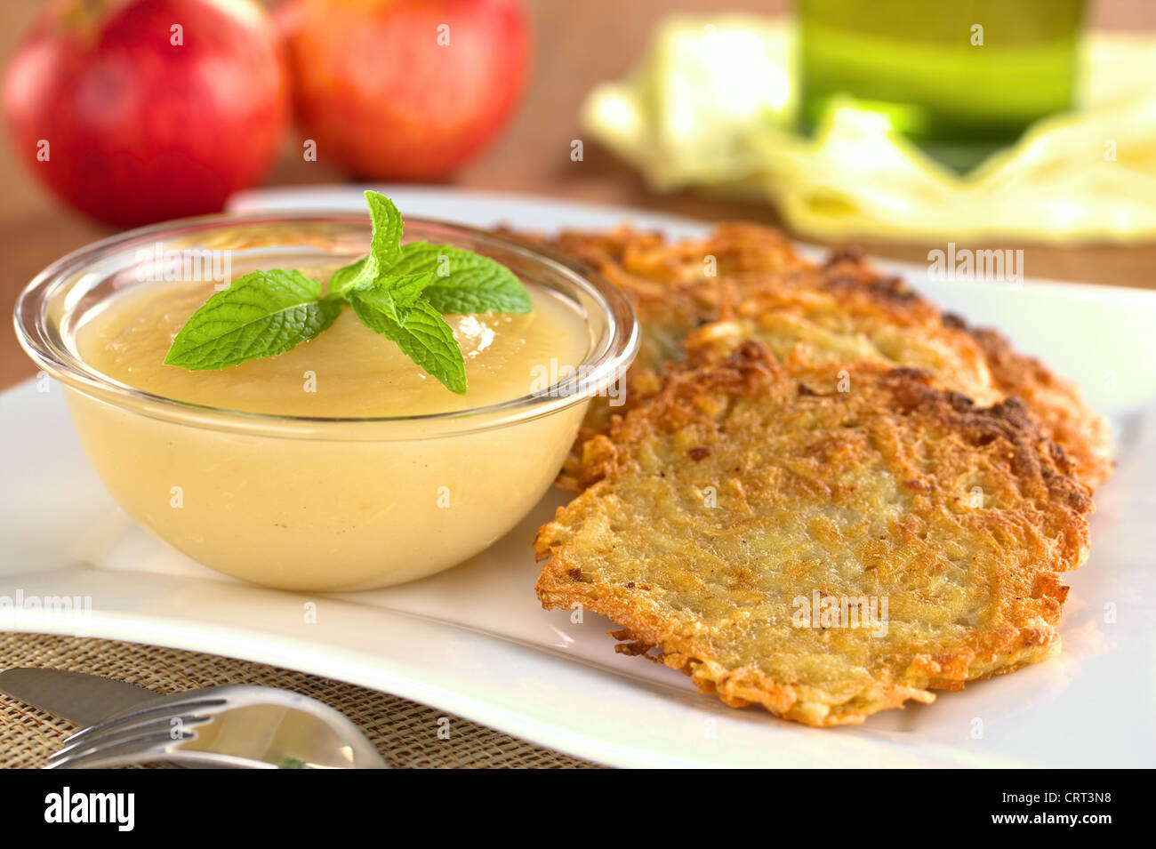 Apple sauce with potato fritters, a traditional German dish Stock Photo