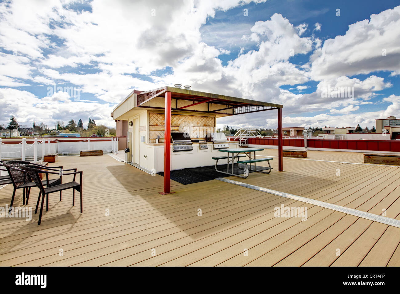 Curated visual reference: Picture Idea: Apartment Building Roof Top Deck With Grill And Sitting Area