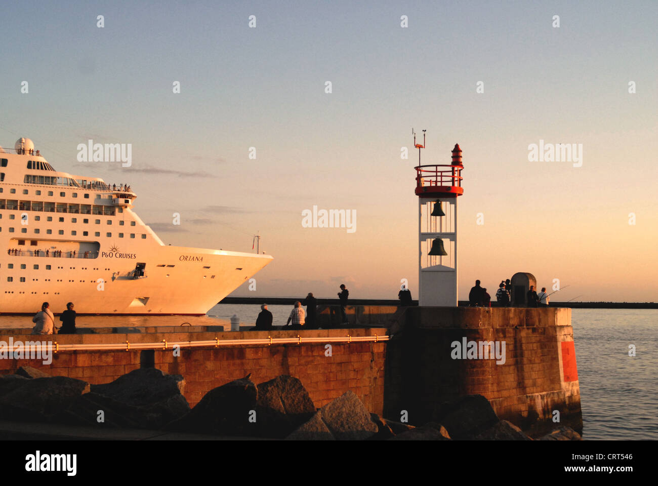 P & O cruise ship leaving the port of Le Havre in Normandy, France, at sun set. Stock Photo