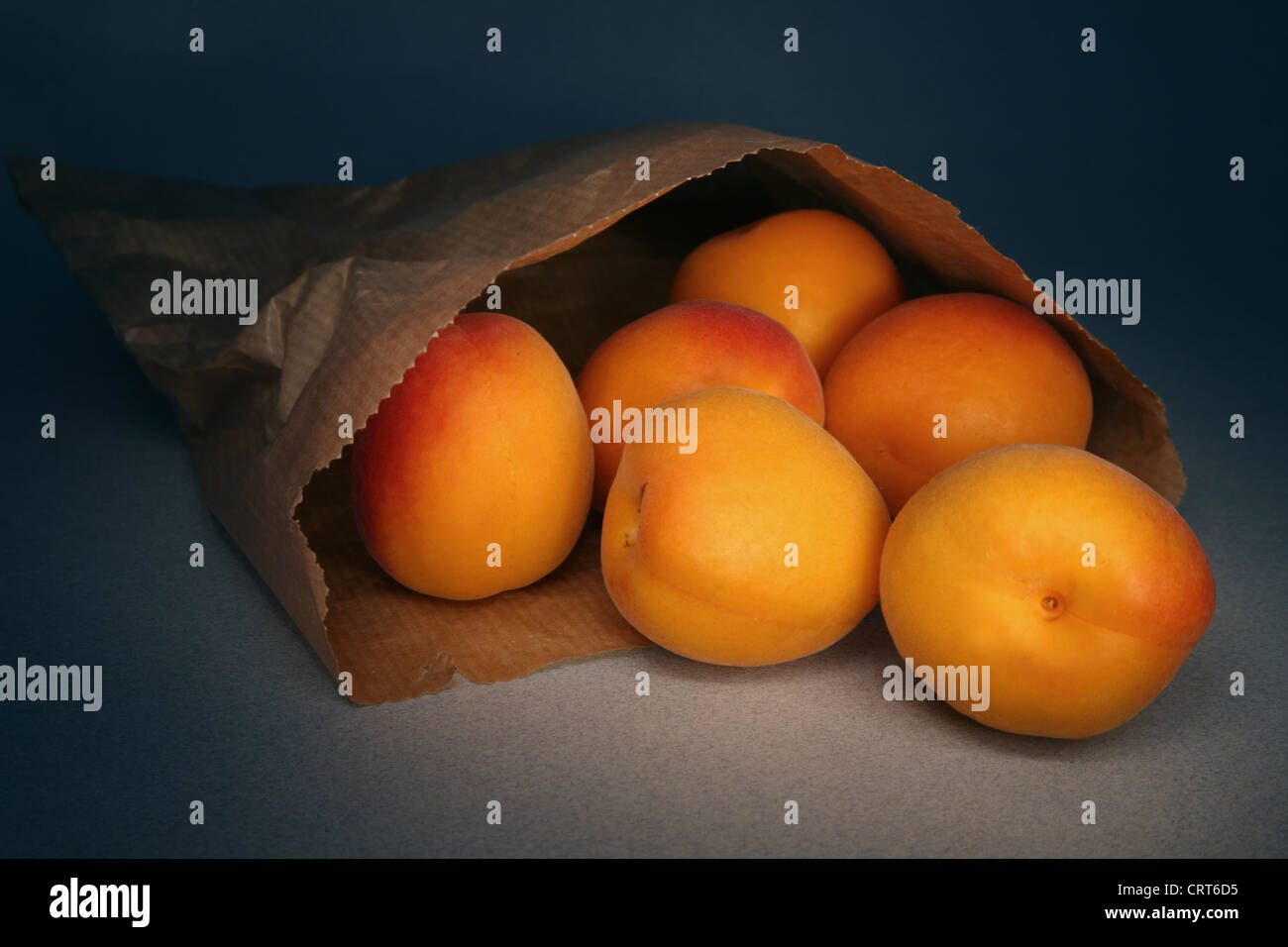 apricots-falling-out-of-a-brown-paper-bag-stock-photo-alamy