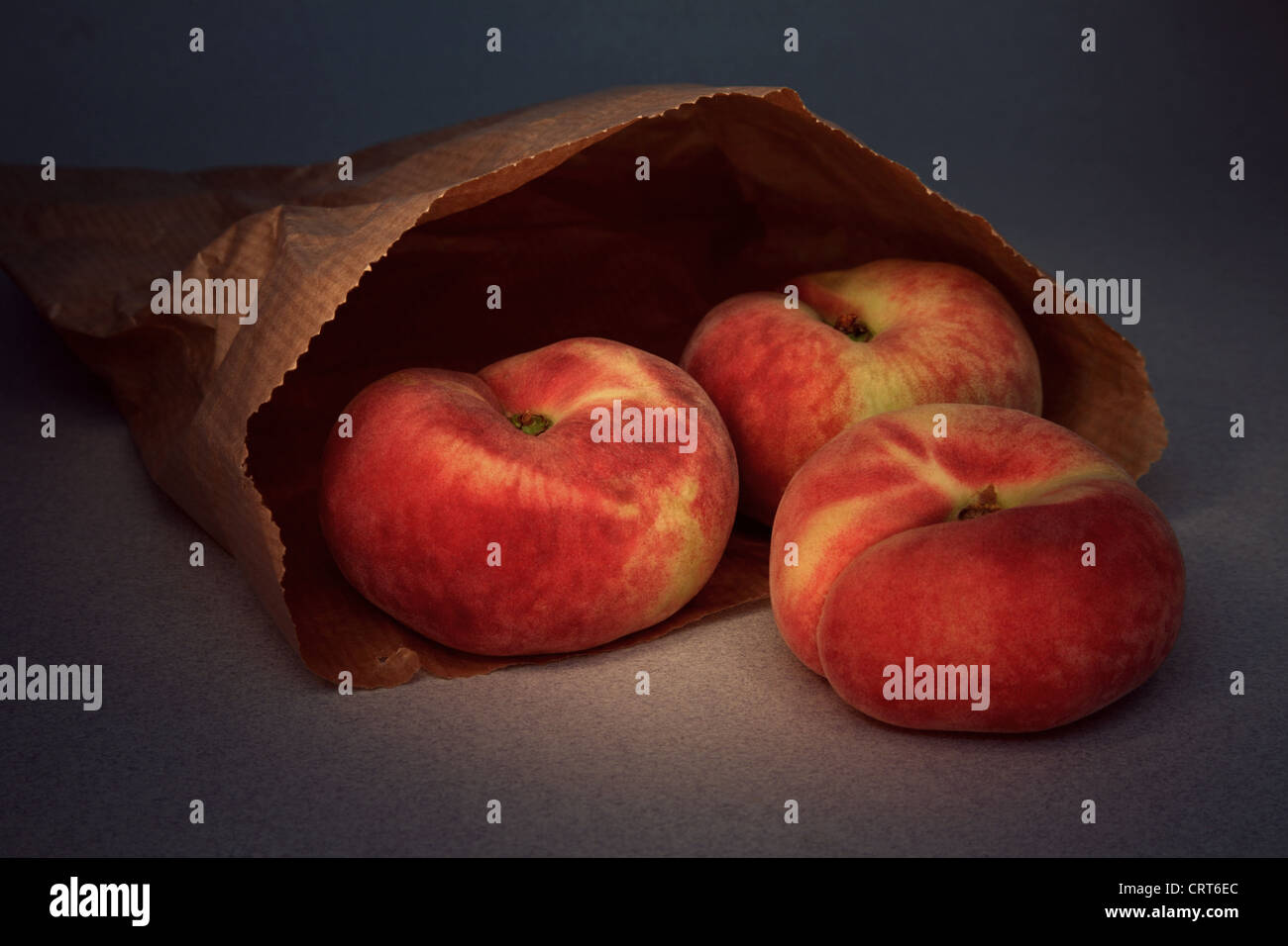 Flat peaches in a brown paper bag Stock Photo Alamy