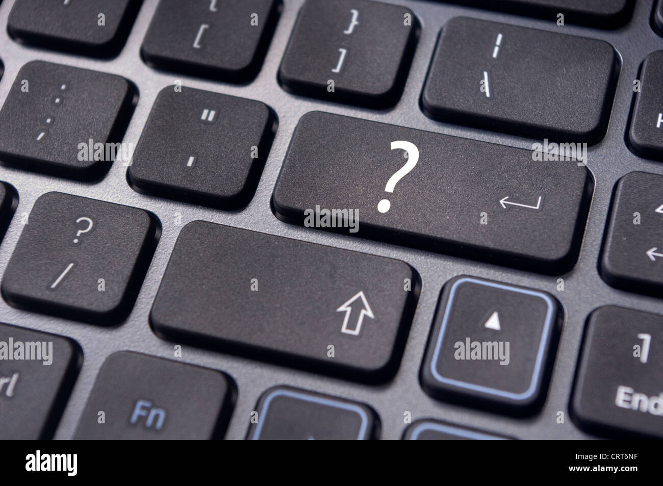concepts of questions or computer errors, with a question on enter key of keyboard. Stock Photo