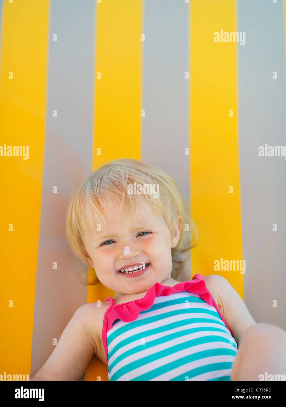 Portrait of baby with sun block creme on nose Stock Photo Alamy
