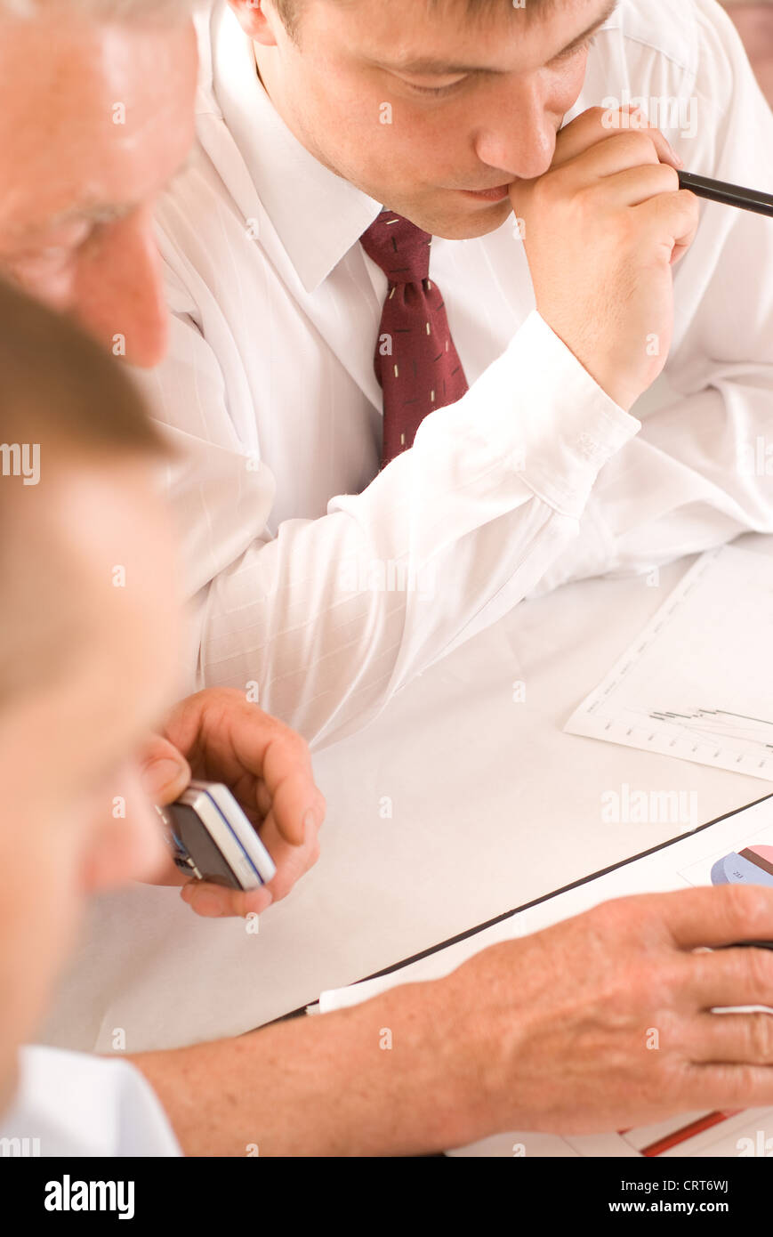 Three businessmen on a white background Stock Photo - Alamy