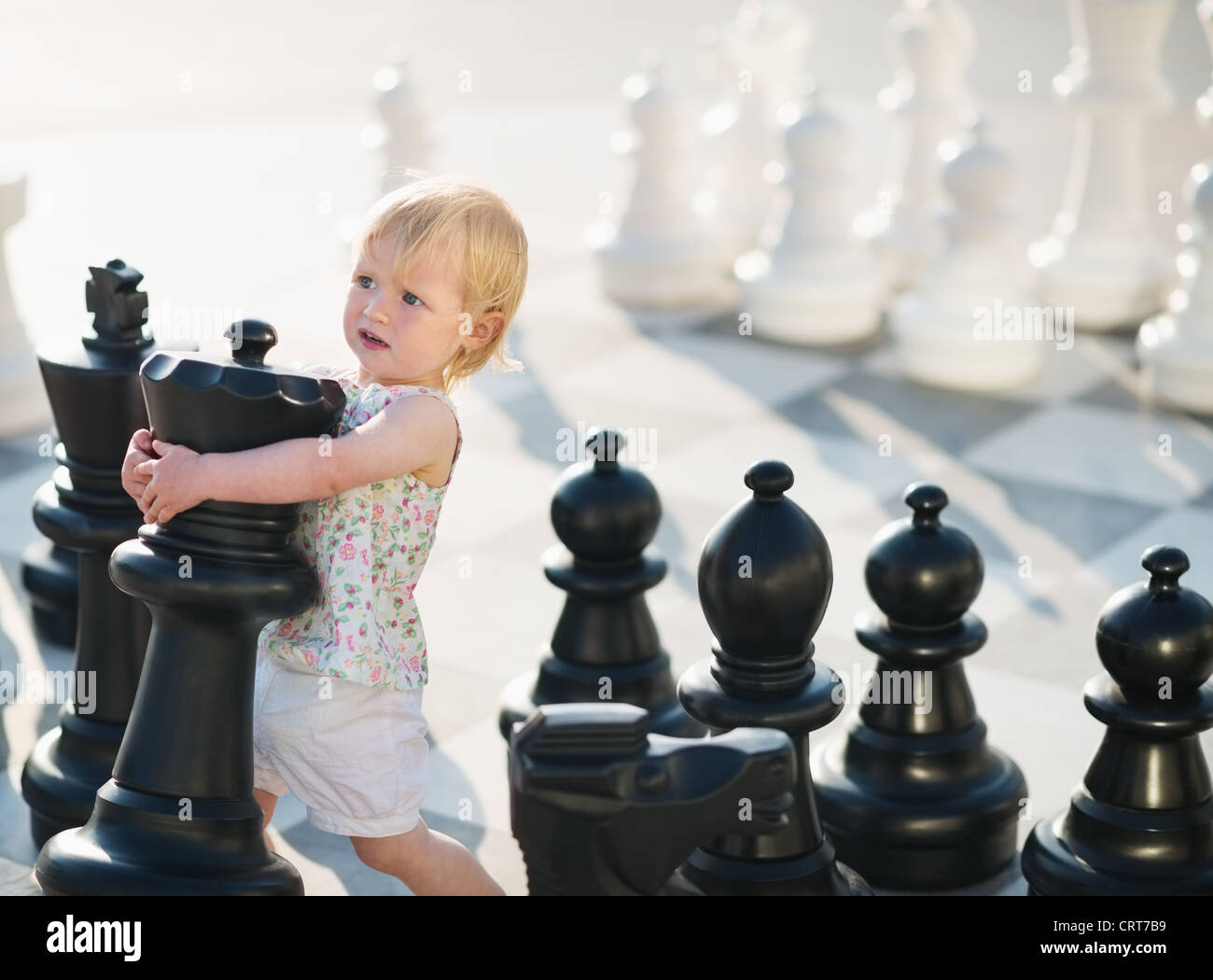 Baby playing in chess Stock Photo