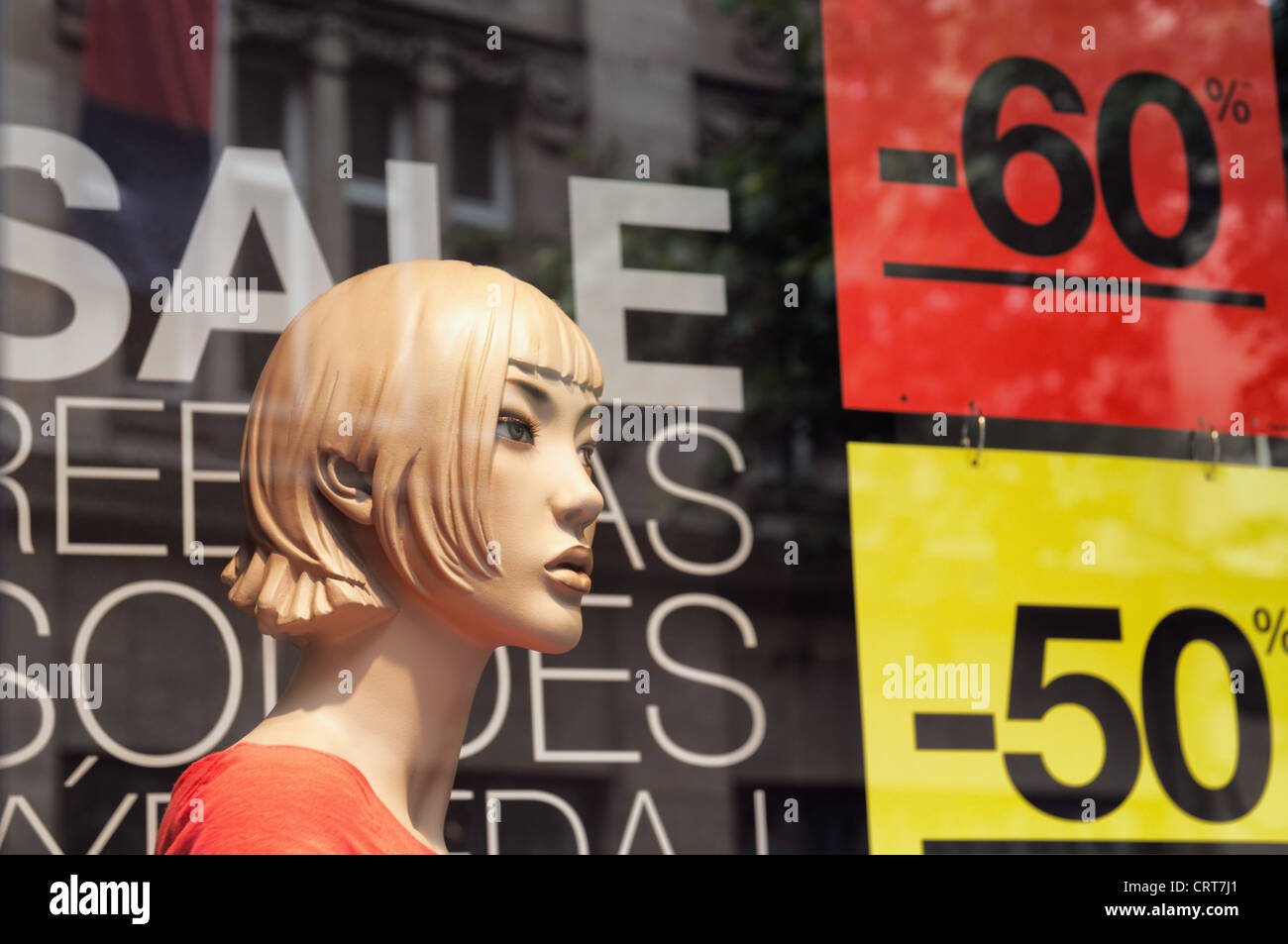 Discount signs in a shop window. Stock Photo
