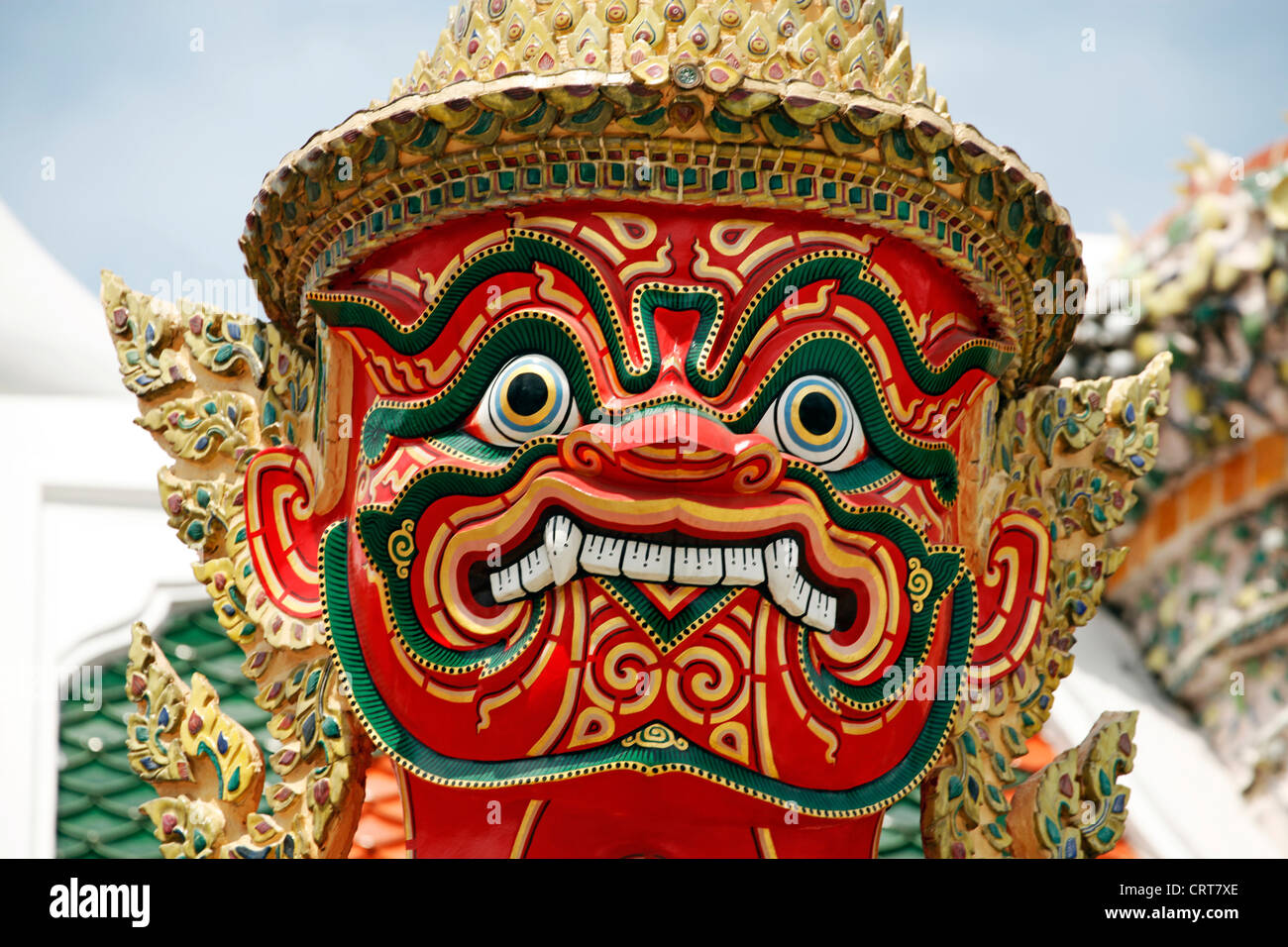 Temple Guardian Giant Suriyaphob with ugly, grotesque mask at the Grand Palace Complex, Wat Phra Kaew, Bangkok, Thailand. Stock Photo