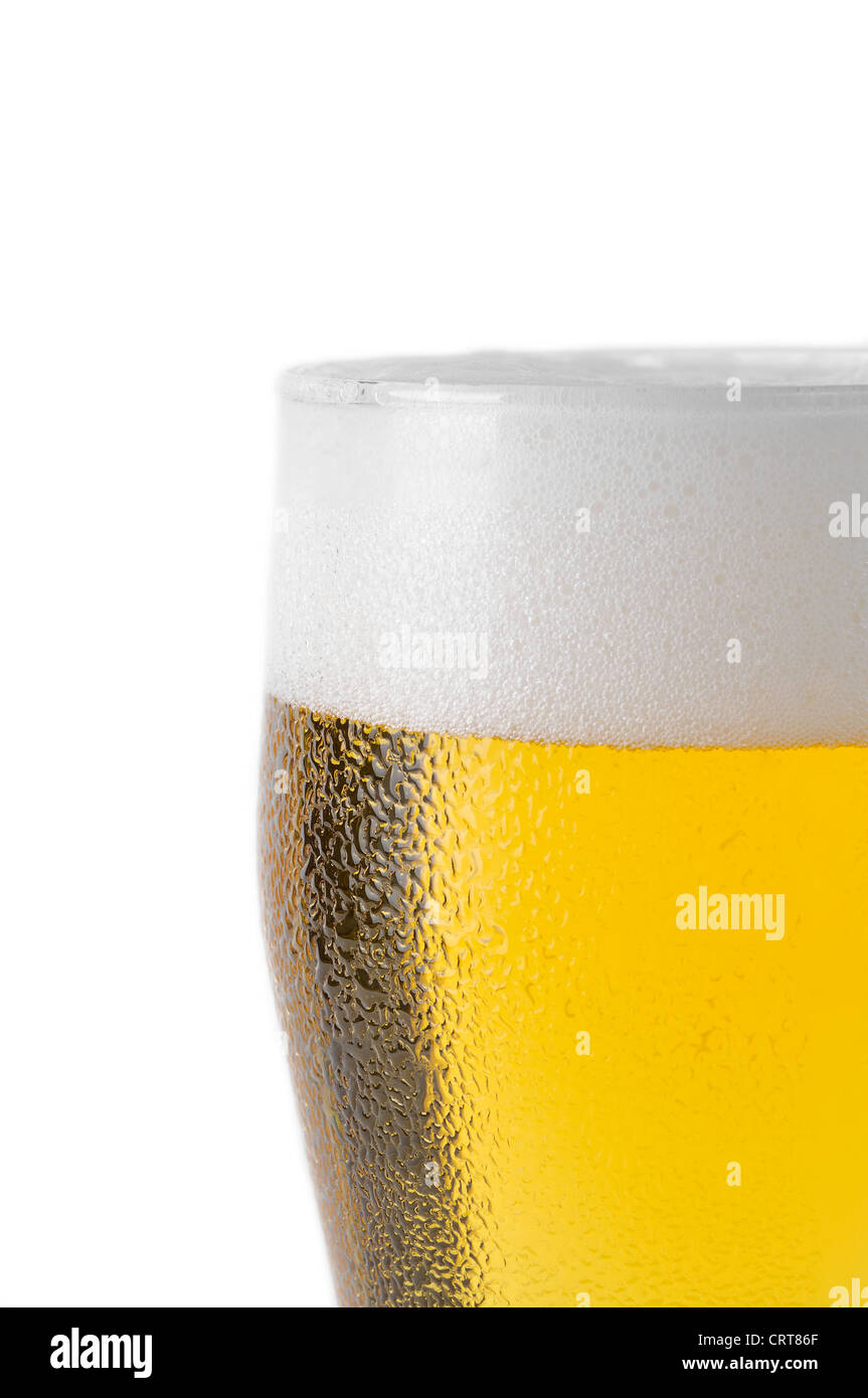 top of beer glass with foam and water droplets Stock Photo