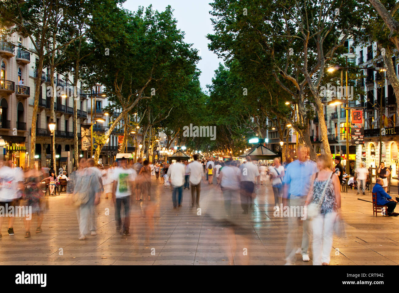 Crowd of tourists walking down the Rambla at night, Barcelona, Catalonia, Spain Stock Photo