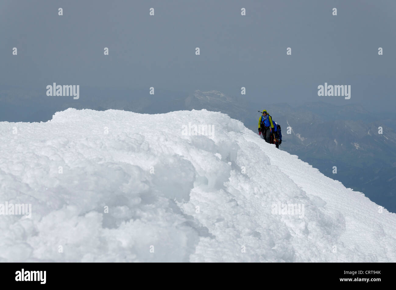 Climbers arriving at the top of Mont Blanc Stock Photo