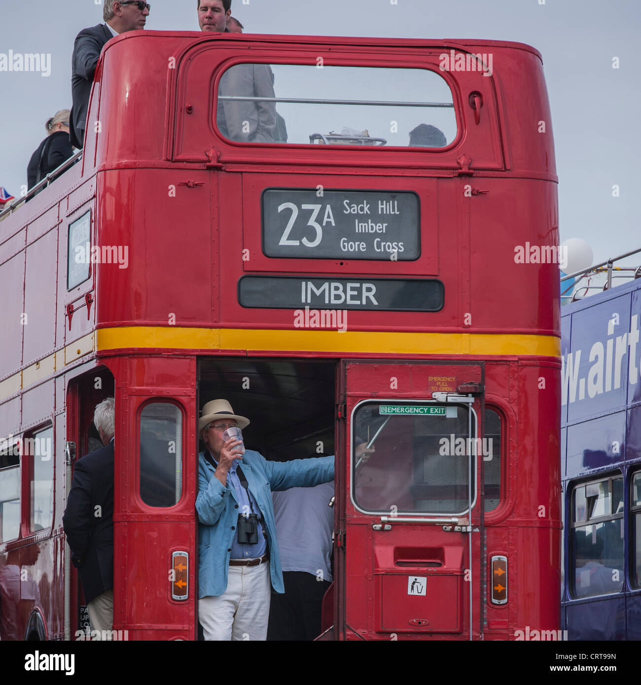 Epsom Derby festival-goers celebrate on a London bus Stock Photo