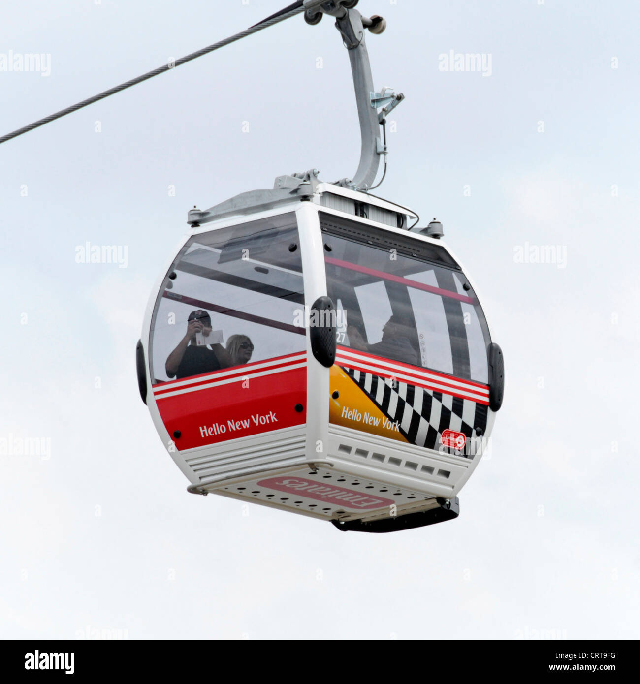 Emirates Air Line sponsored cable car service crossing the River Thames ...