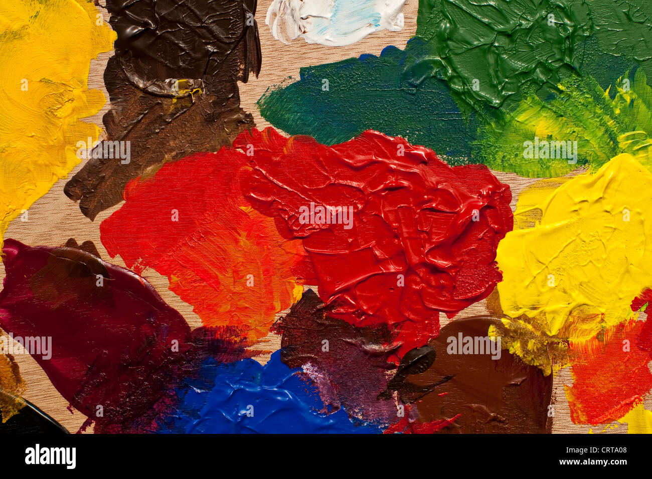 Painting Palette with multicolored paints being mixed Stock Photo Alamy