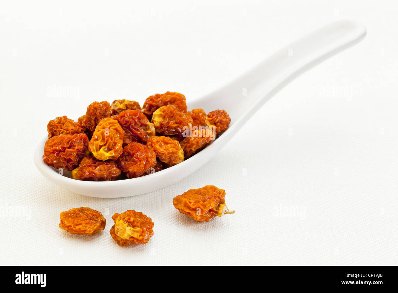 dried goldenberries (physalis peruviana,) ,a ceramic tablespoon Stock Photo