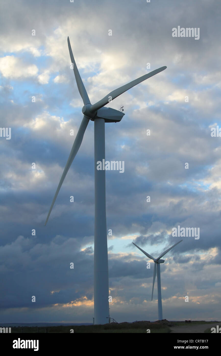 wind turbine against a cloudy sky Stock Photo - Alamy