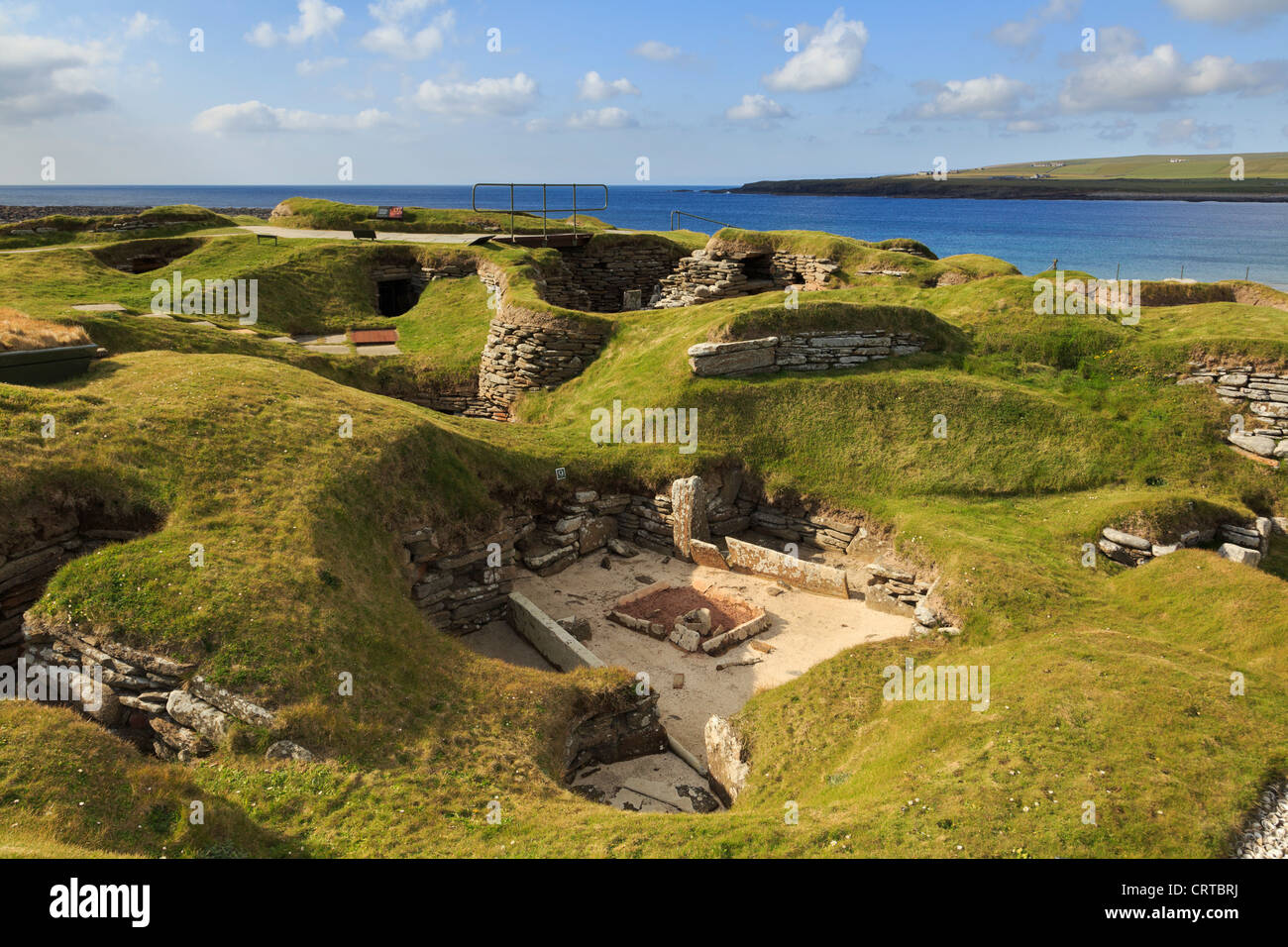 Excavations of ancient prehistoric houses in Neolithic village at Skara Brae by Bay of Skaill Orkney Islands Scotland UK Stock Photo