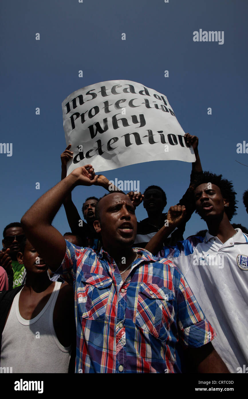 African migrants taking part in a demonstration against the deportation policy of asylum seekers and illegal immigration by Israeli government in front of the US embassy in Tel Aviv Israel Stock Photo