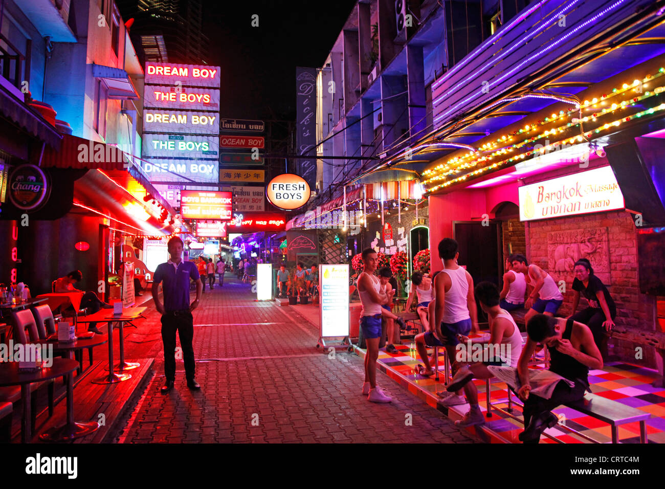 Neon lights and signs for gogo boys and bars in Soi Twilight in the red light district in