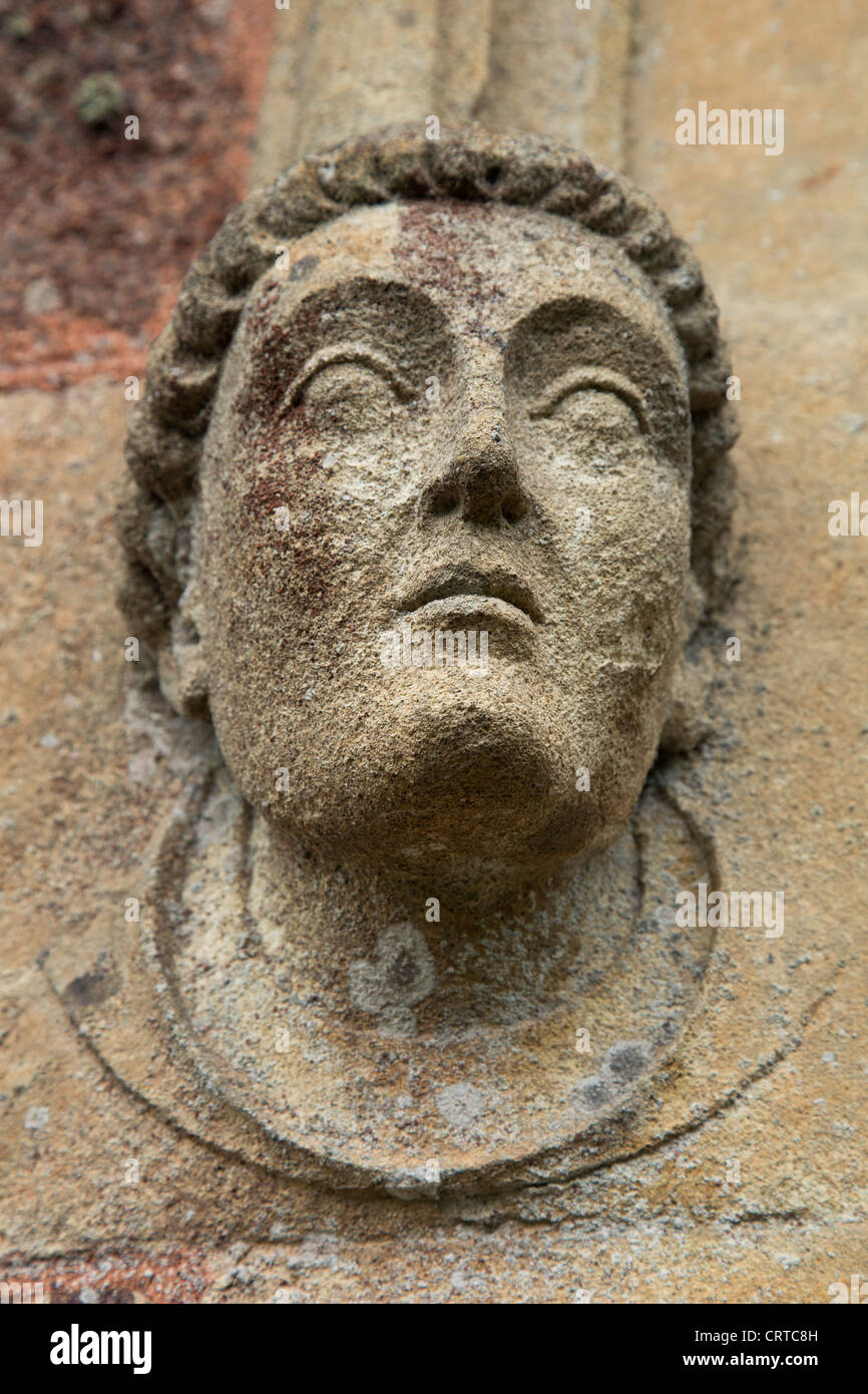 Stone head of a monk Stock Photo Alamy
