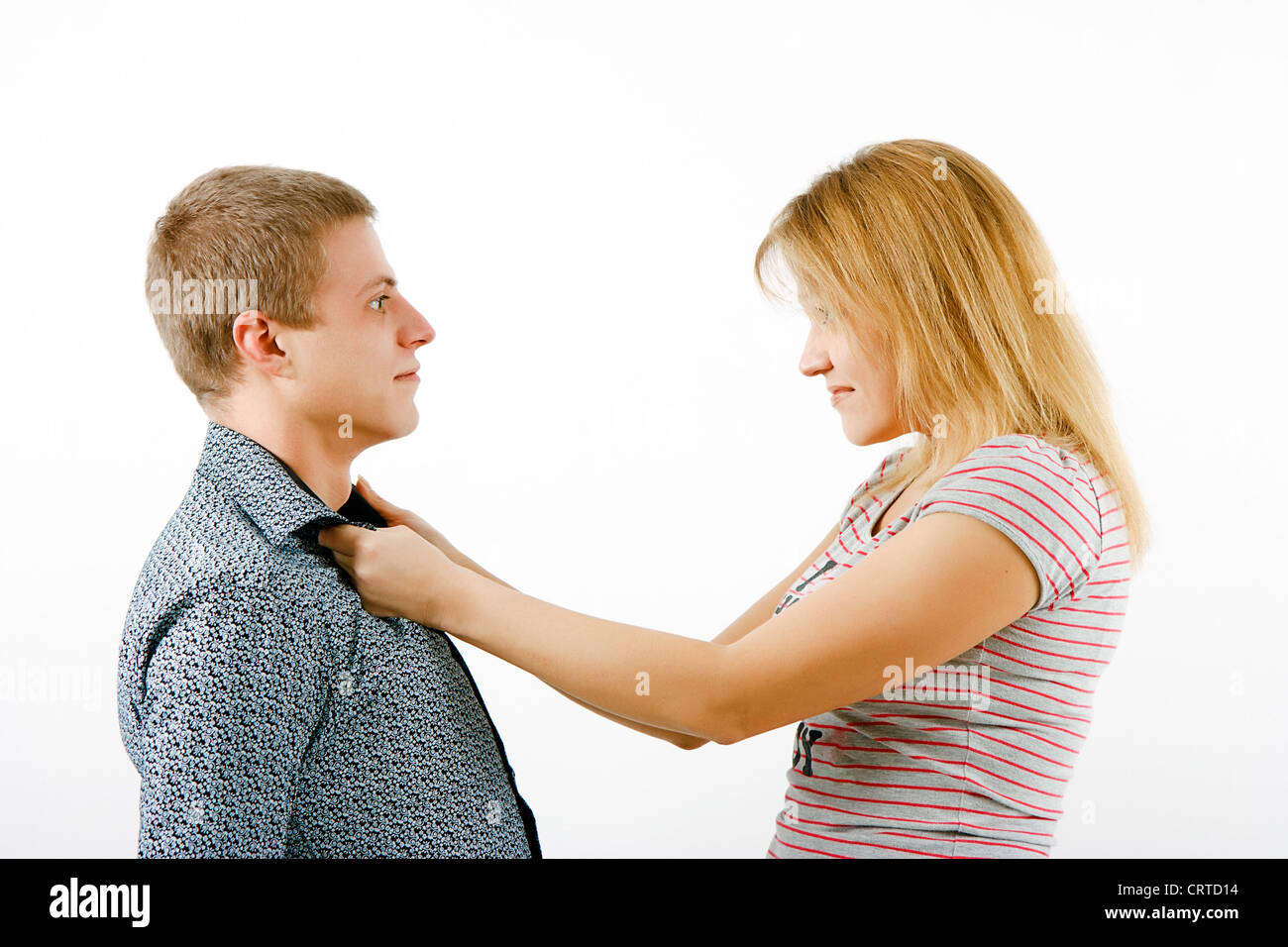 Violence in the family. Wife beats husband Stock Photo - Alamy