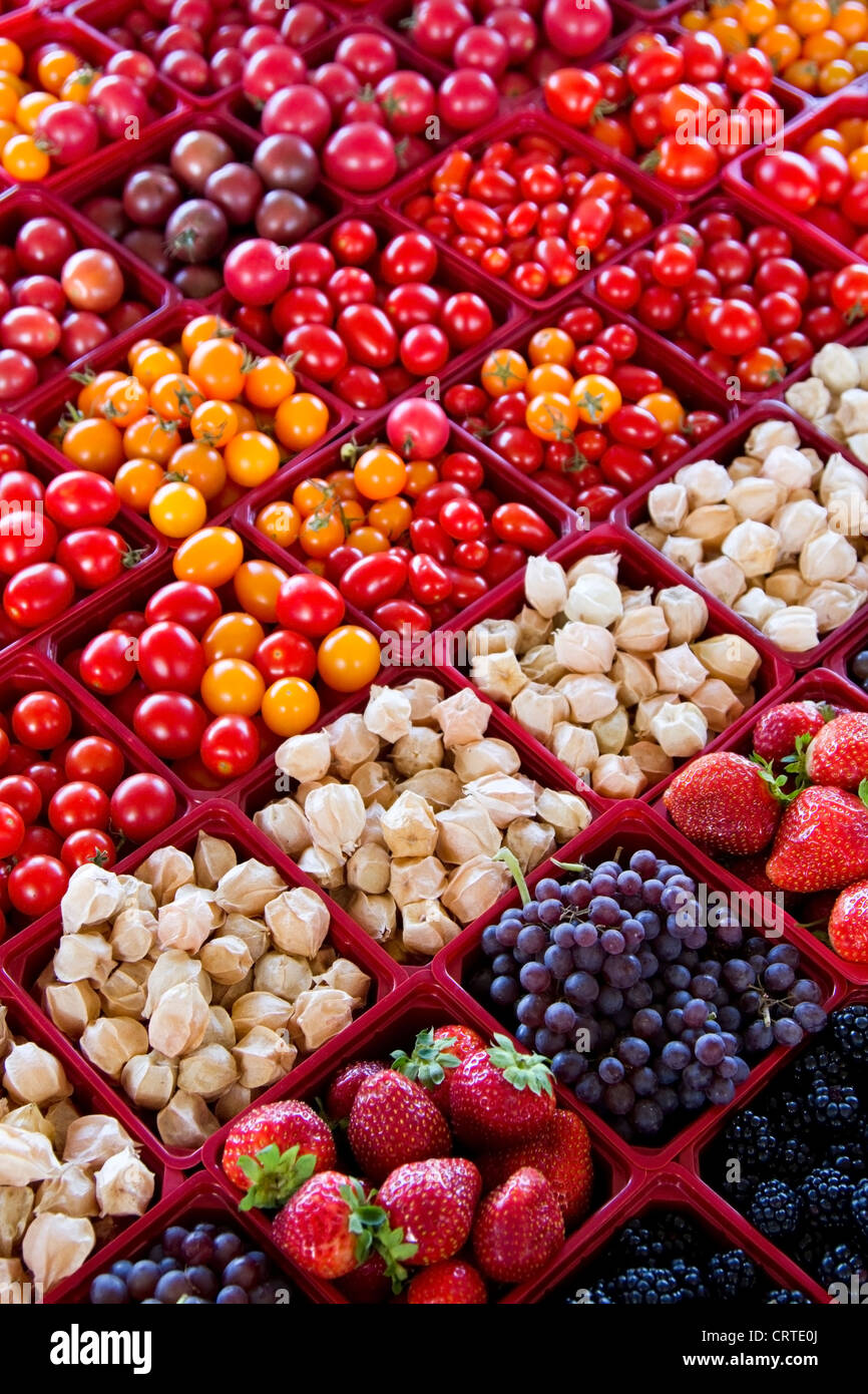 Assortment of berries and tomatoes for sale at Jean Talon Market, Montreal, Quebec Stock Photo