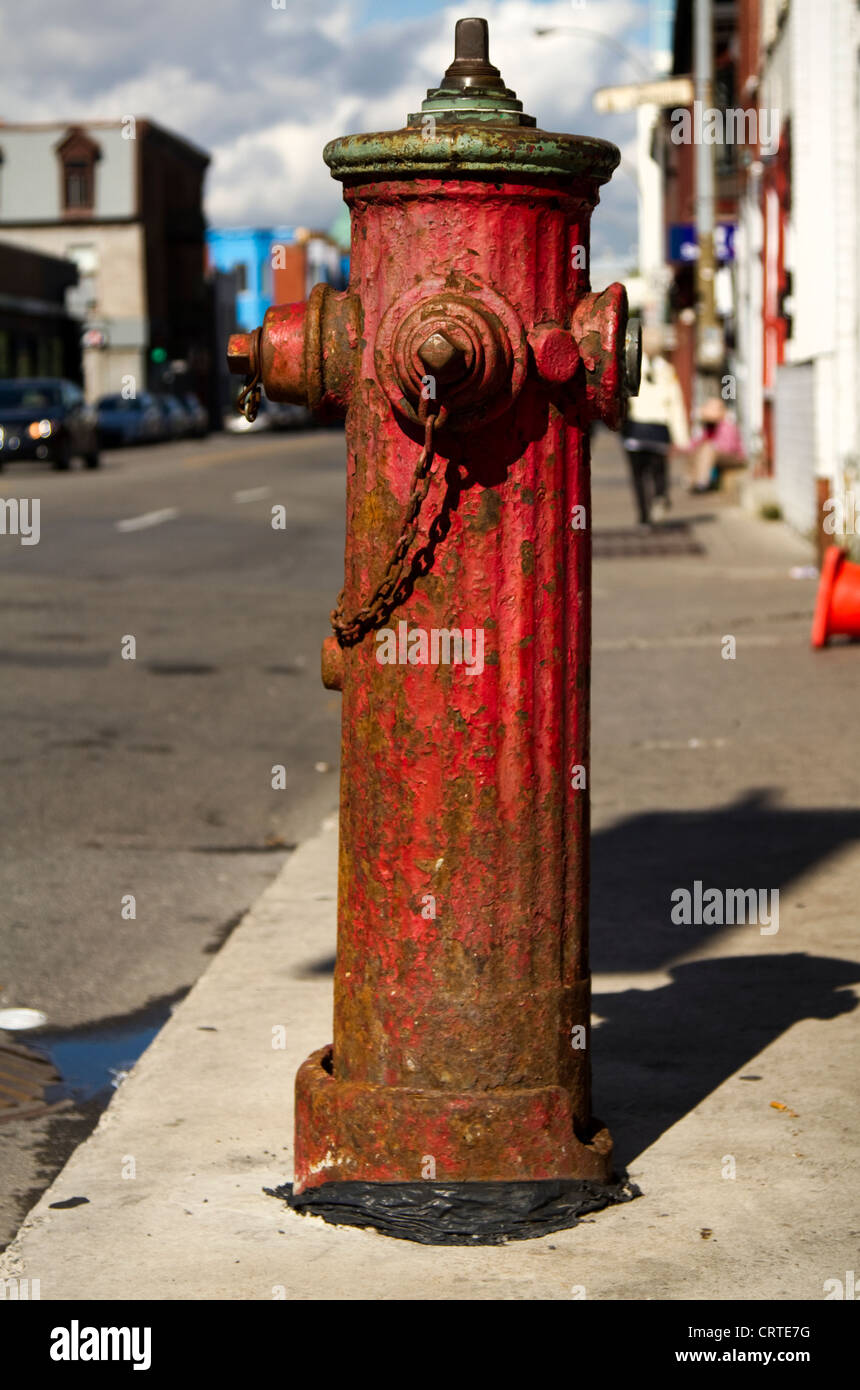 An old fire hydrant on the streets of Montreal, Quebec Stock Photo