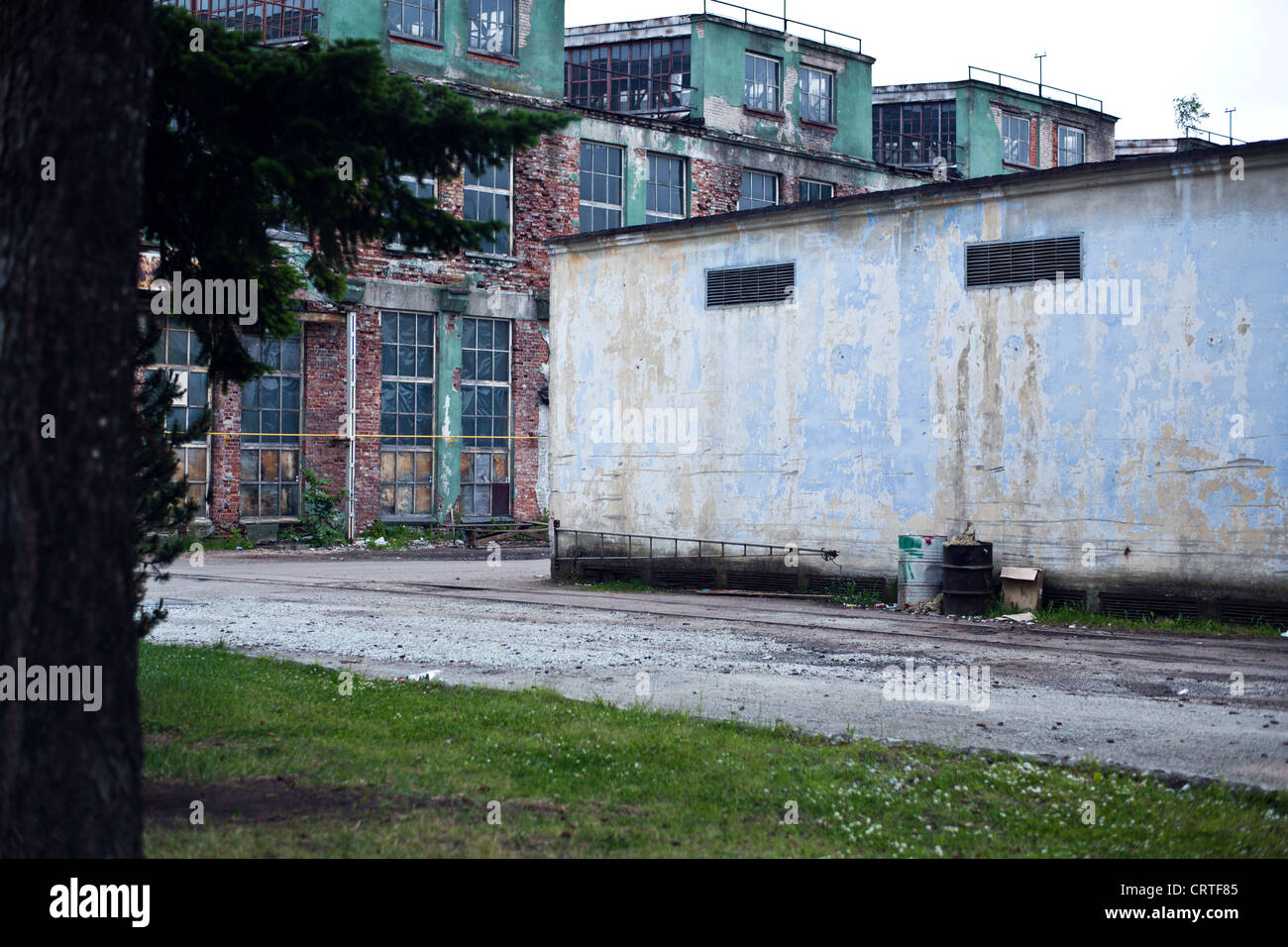 Discard old industrial factory exterior with buildings and smokestack ...