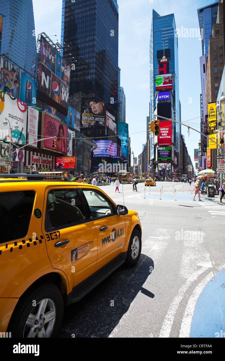 The iconic yellow taxi cab in Times Square, New York city USA. buildings modern cities.Times square new York,times square,times Stock Photo