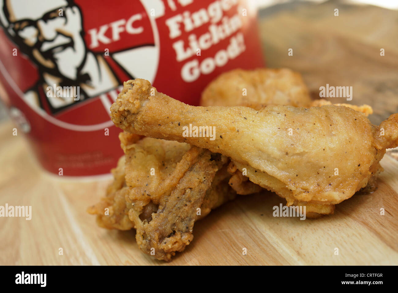 KFC, Kentucky Fried Chicken bucket and Drumsticks Stock Photo