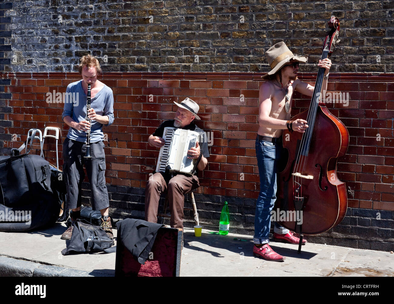 Jazz band trio performing at Columbia Road Flower Market, London, England, UK Stock Photo