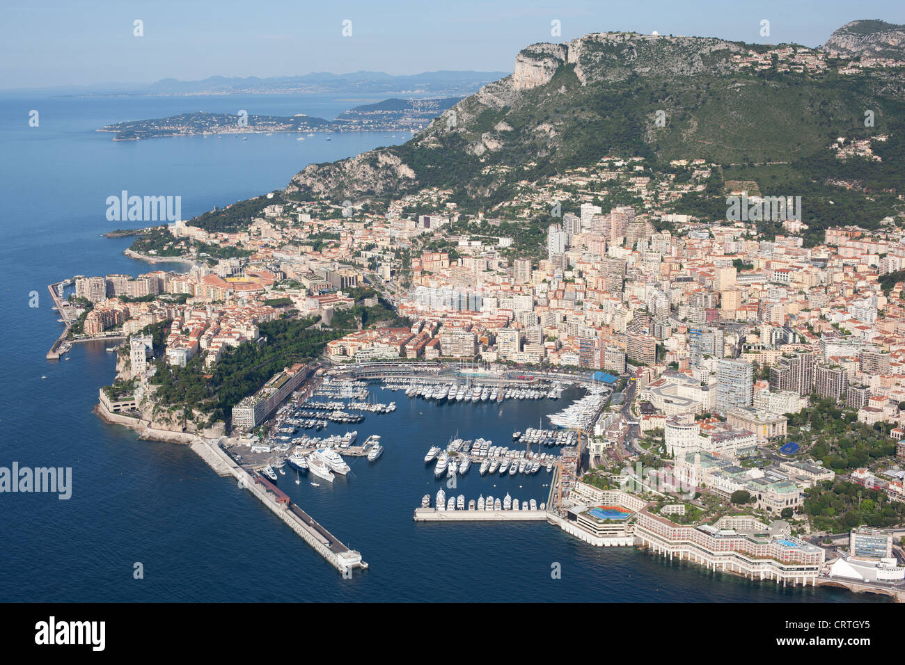 AERIAL VIEW. Principality of Monaco with Hercules Port and Monte-Carlo. Above the cliff, the Tête de Chien viewpoint (550m asl) in La Turbie, France. Stock Photo