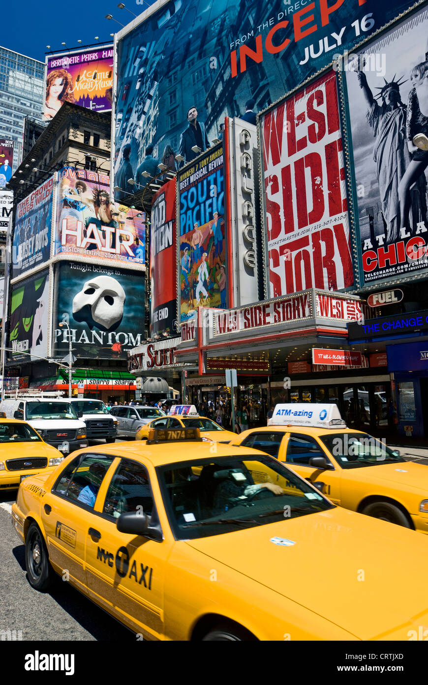 Times Square New York Yellow Taxi, New York City Daytime Broadway Theater Billboards and Yellow Taxis Stock Photo