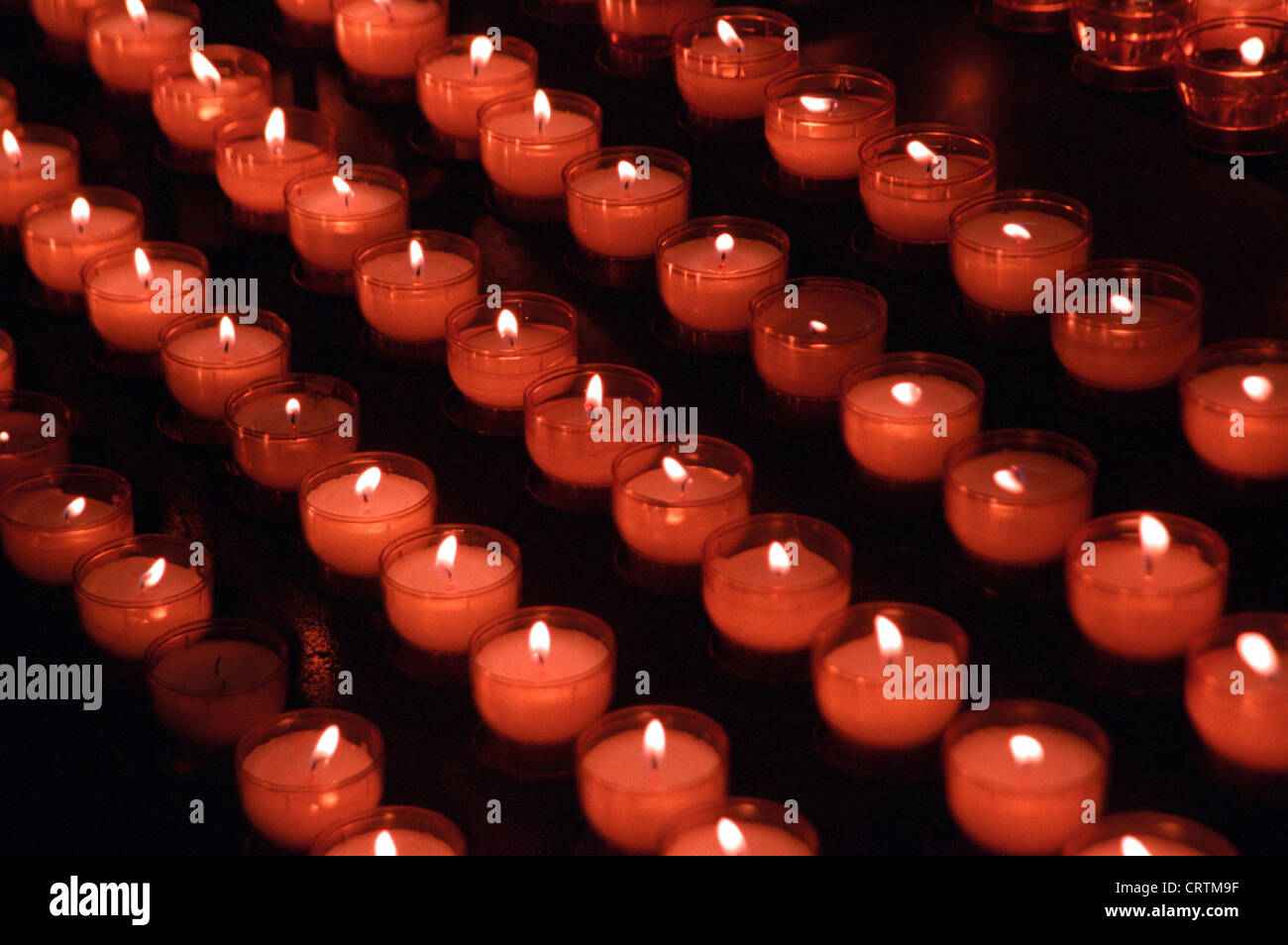 Votive candles in church Stock Photo - Alamy