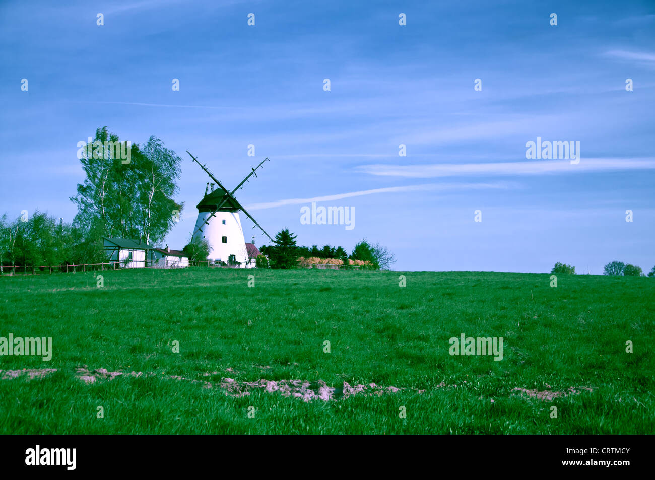 white windmill on farm field Stock Photo Alamy