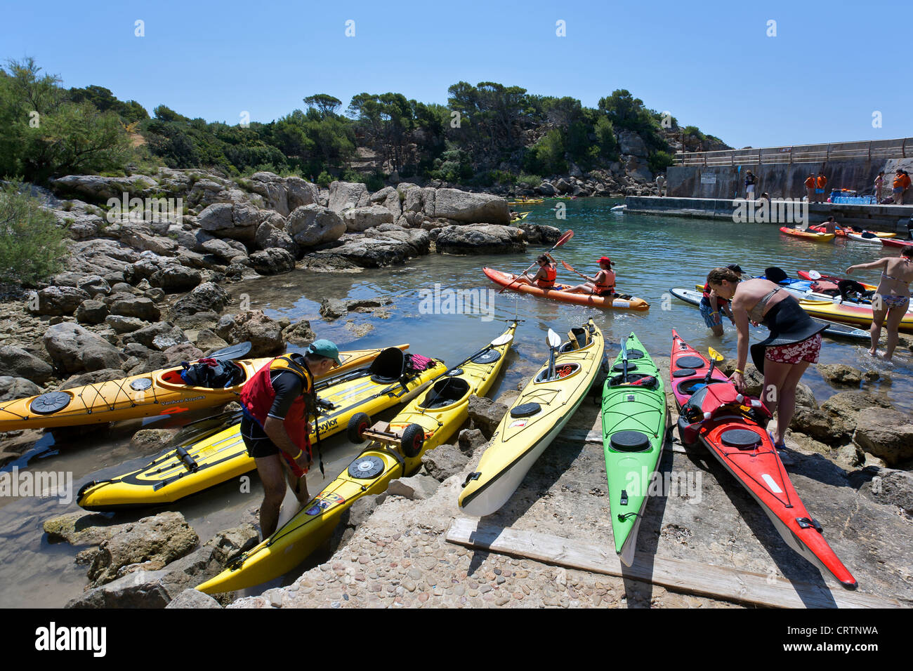Sea kayaks at Cala Lladó. Dragonera Island Natural Park. Mallorca. Spain Stock Photo