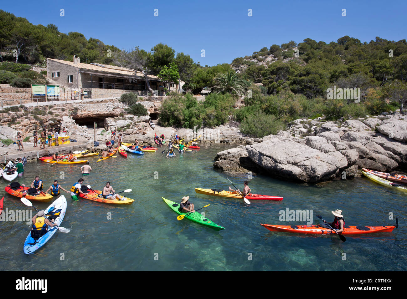 Sea kayakers at Cala Lladó. Dragonera Island Natural Park. Mallorca. Spain Stock Photo