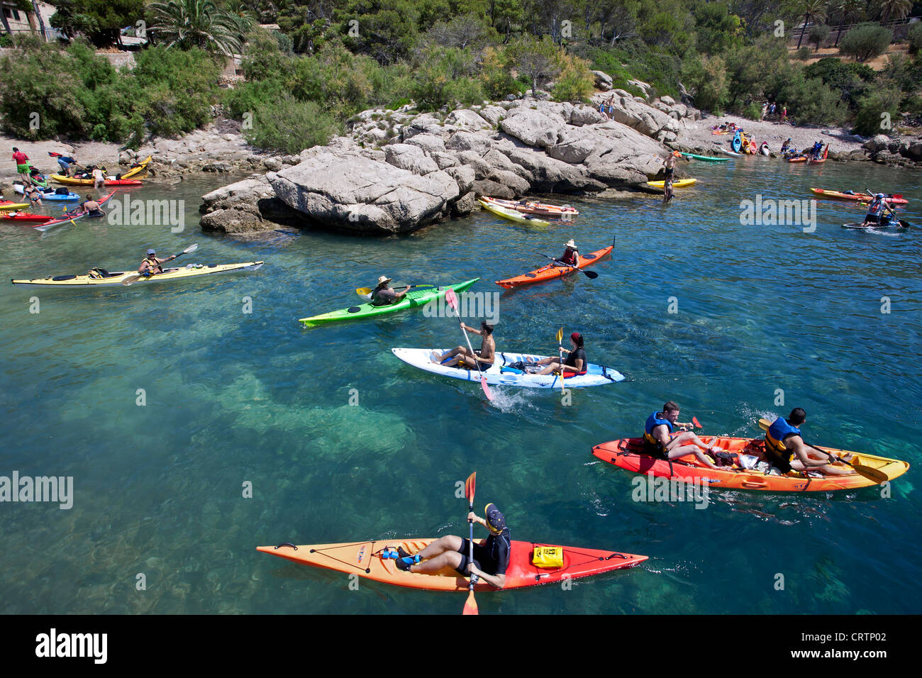 Kayakers at Dragonera Island Natural Park. Cala Lladó. Mallorca. Spain Stock Photo