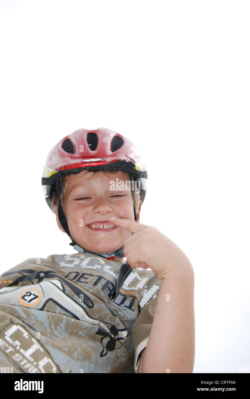 Cheerful gesticulating child / helmet boy Stock Photo