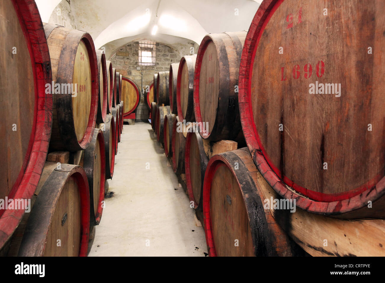Oak Barrels in the cellars of Cremisan Winery in Beit Jala near Bethlehem, Palestine Stock Photo