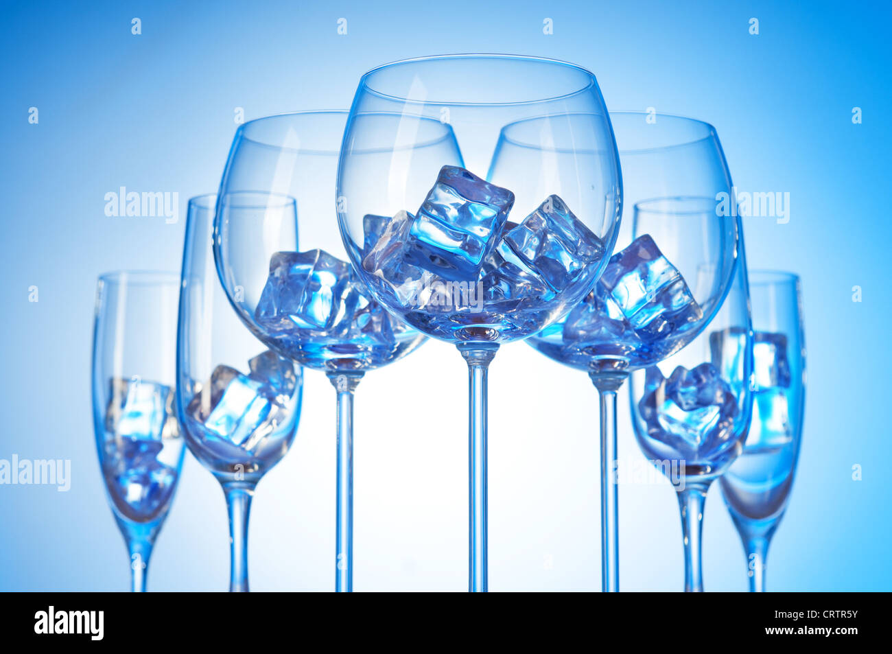 Glasses of water against gradient background Stock Photo