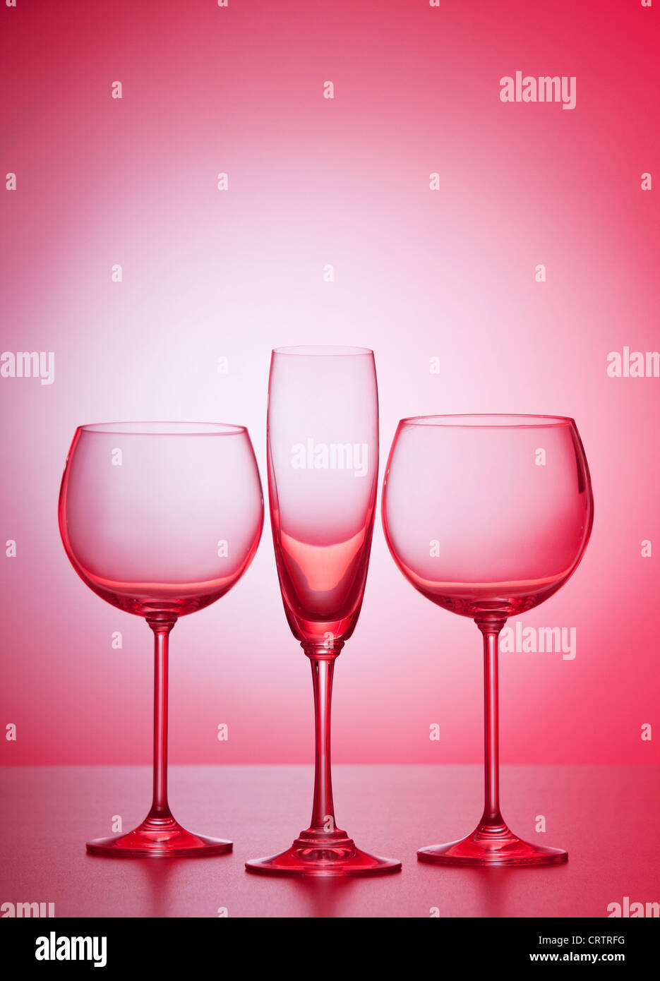 Wine glasses against gradient background Stock Photo