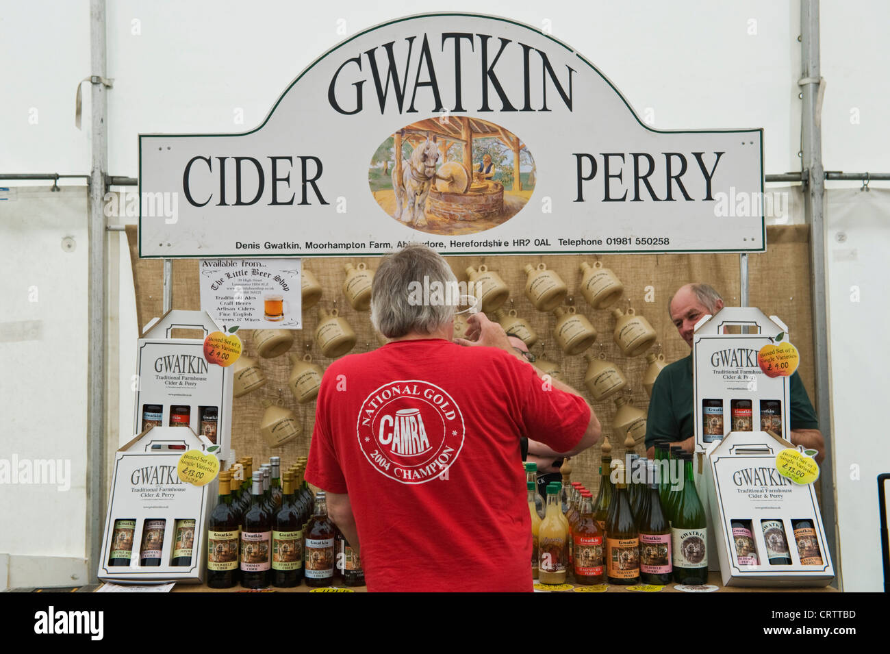 Visitors browsing Gwatkin cider stall in marquee at Shobdon Food
