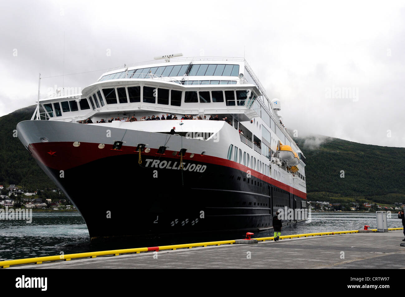 Norway. Norwegian Coastal Express ship docking at Tromso.  This service is over a hundred years old. Stock Photo