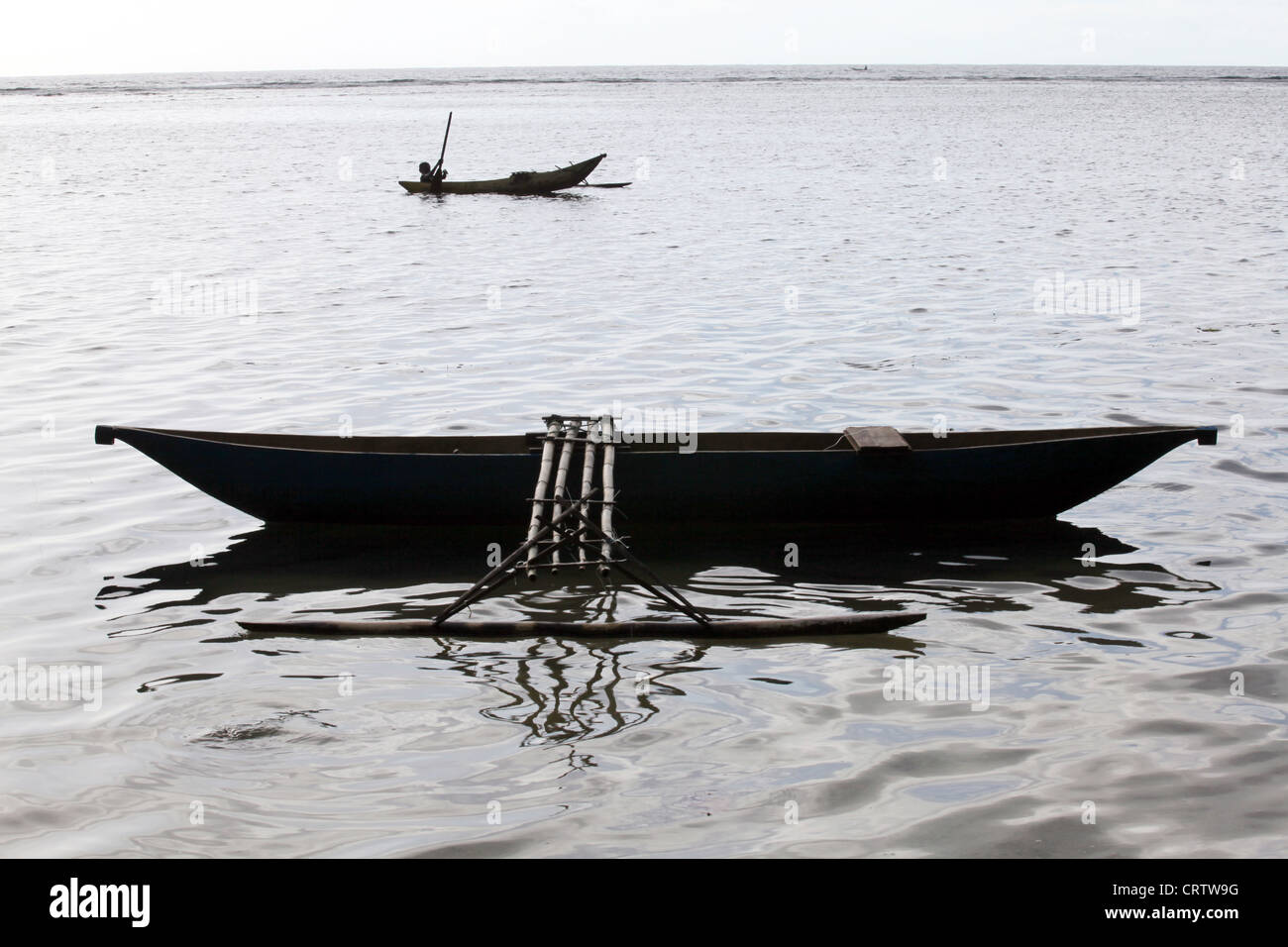 wooden outrigger boat on the beach of Bougainville island Stock Photo