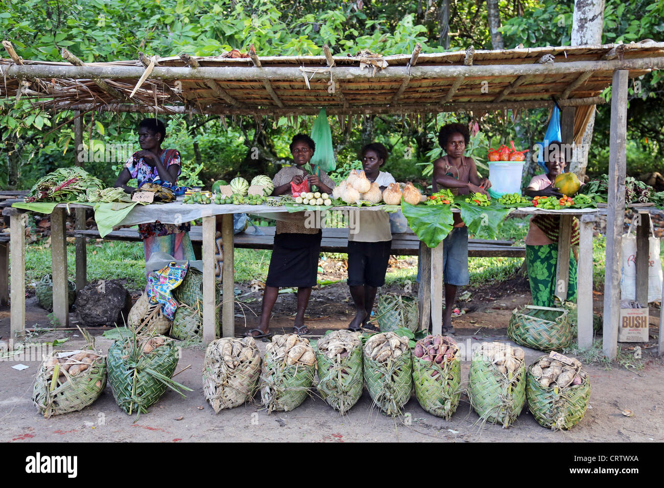 women behind a market stall on the road to Arawa, Bougainville island, Papua New Guinea Stock Photo