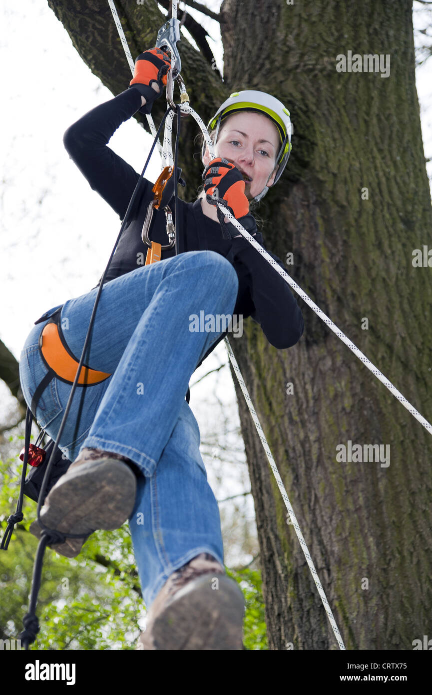 young woman climbing Stock Photo