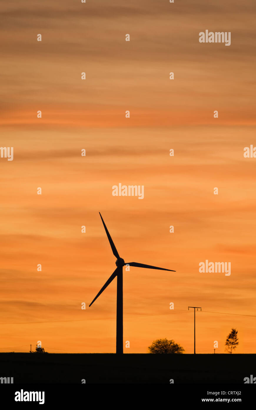 Wind turbine at sunset Stock Photo