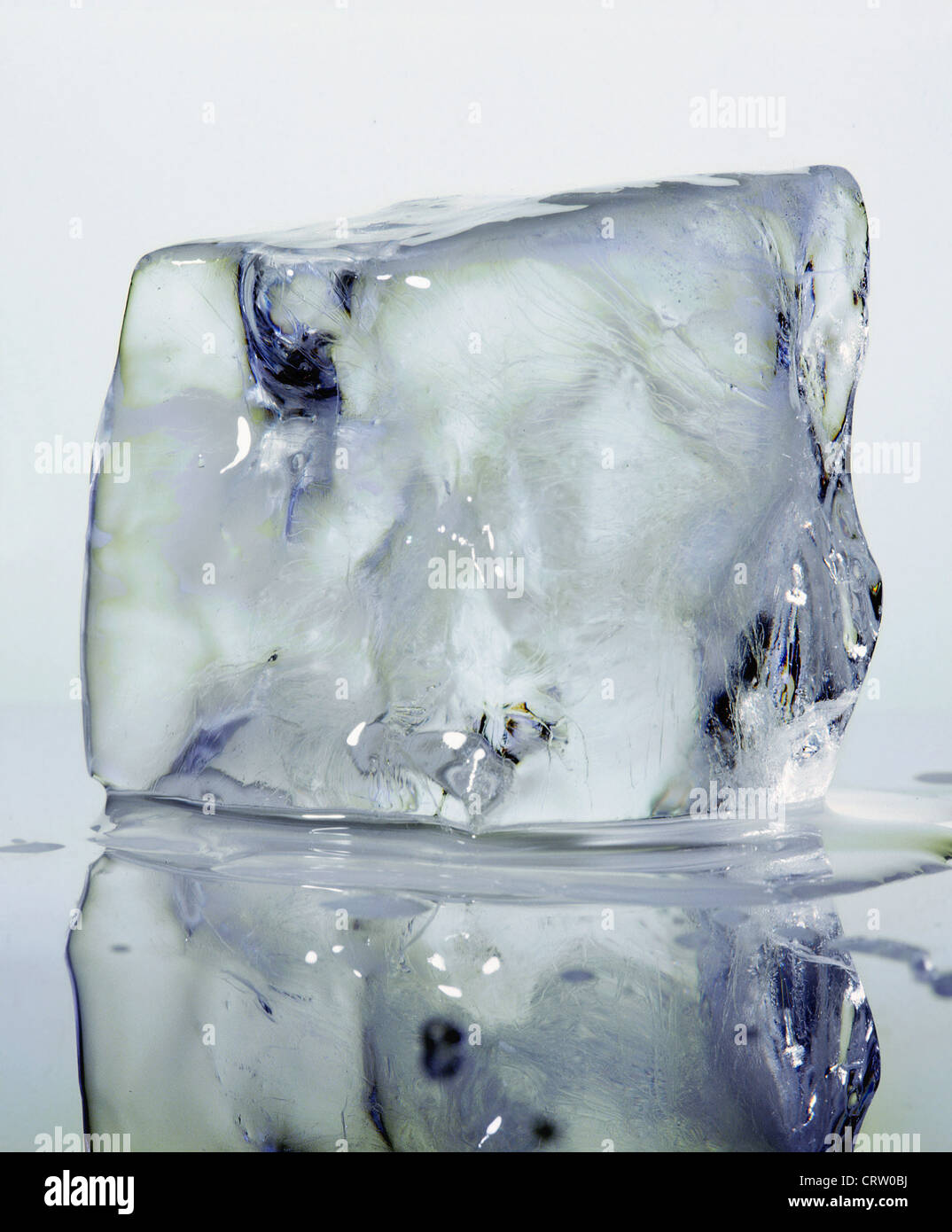 Ice cube melts on mirror Stock Photo Alamy